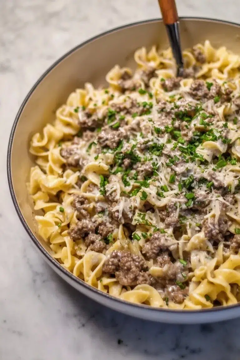 30-minute ground beef stroganoff served with noodles and garnished with parsley