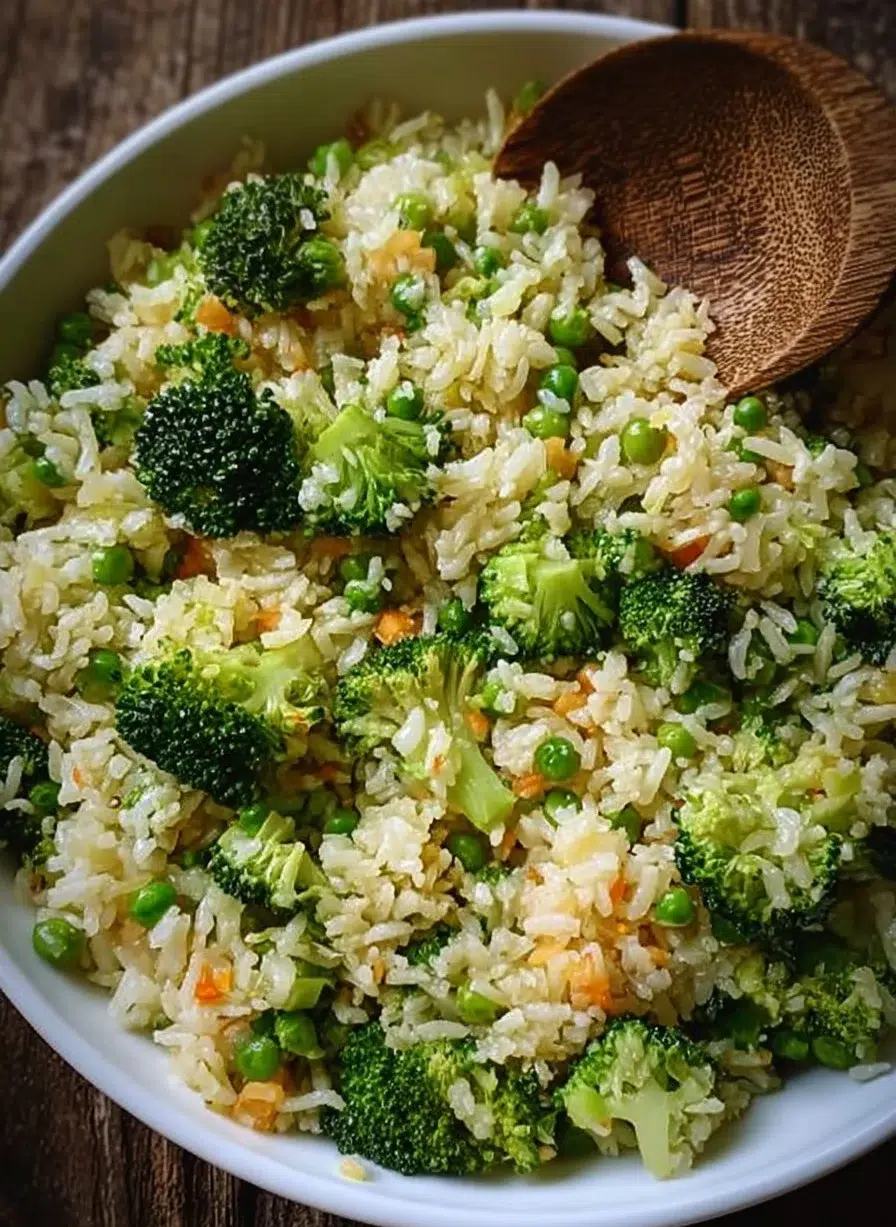 Bowl of broccoli rice topped with herbs and spices