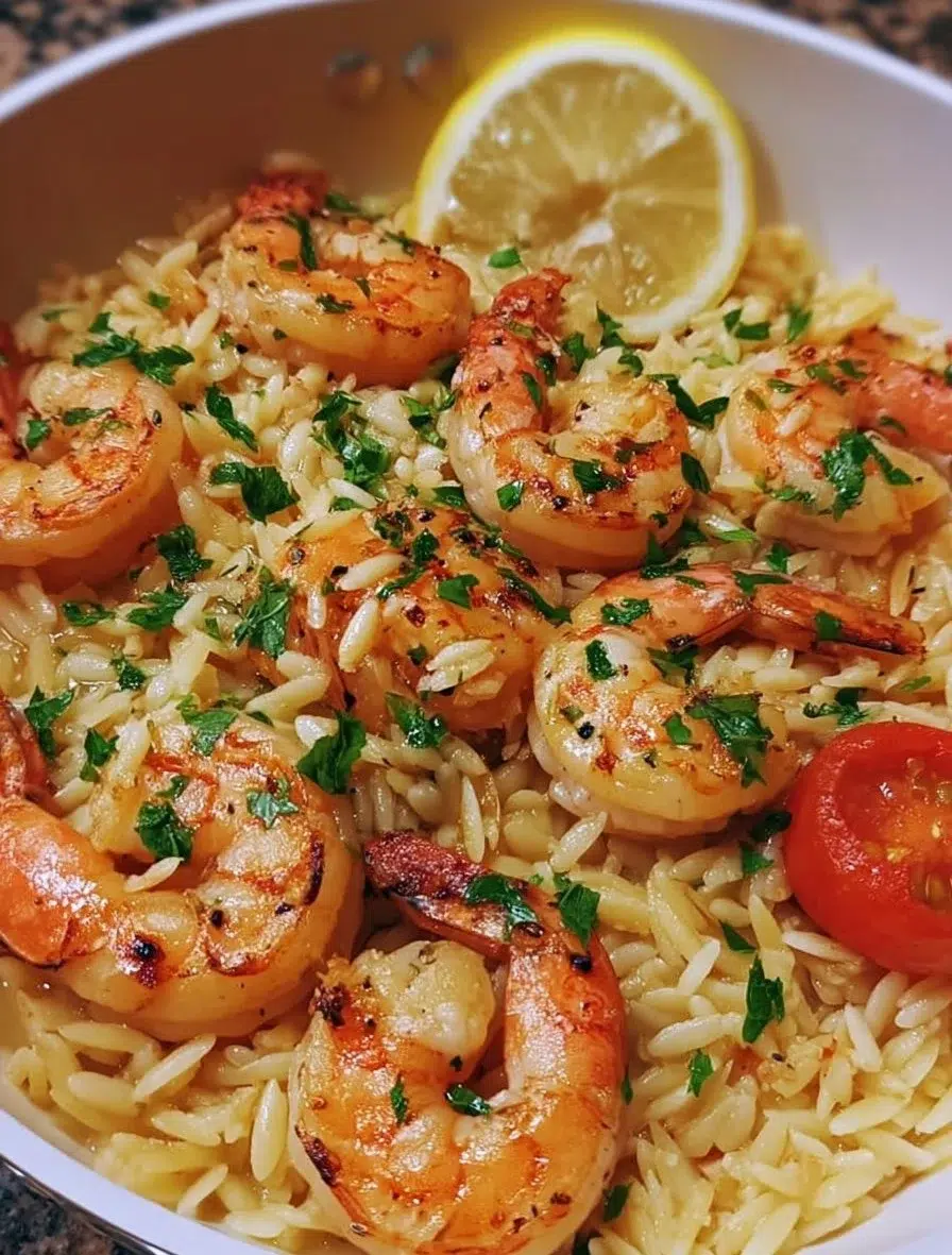 Delicious one-pot garlic butter shrimp with orzo pasta served in a skillet.