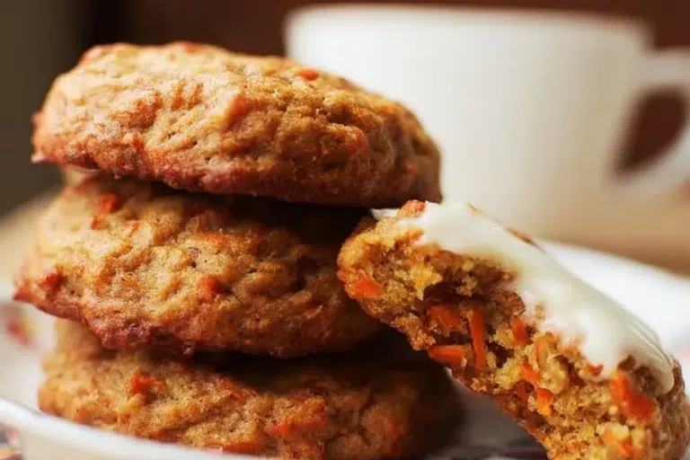 Freshly baked Carrot Cake Cookies on a stylish plate with frosting
