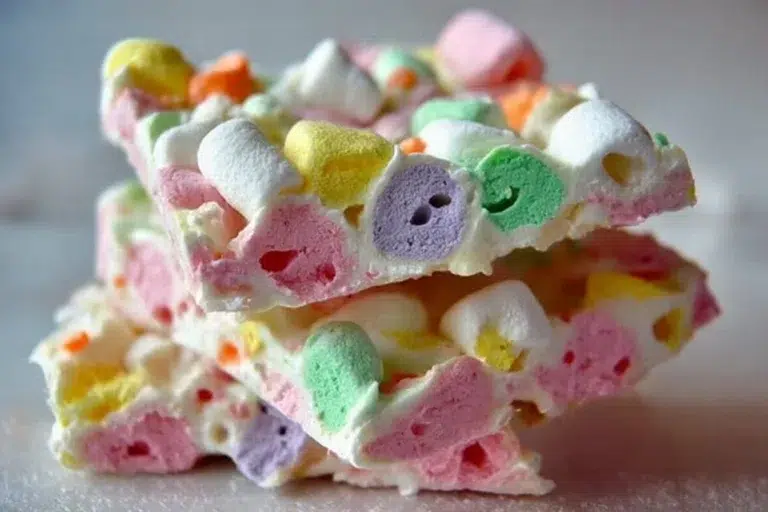 Colorful Easter marshmallow bark decorated with pastel candies and chocolate.