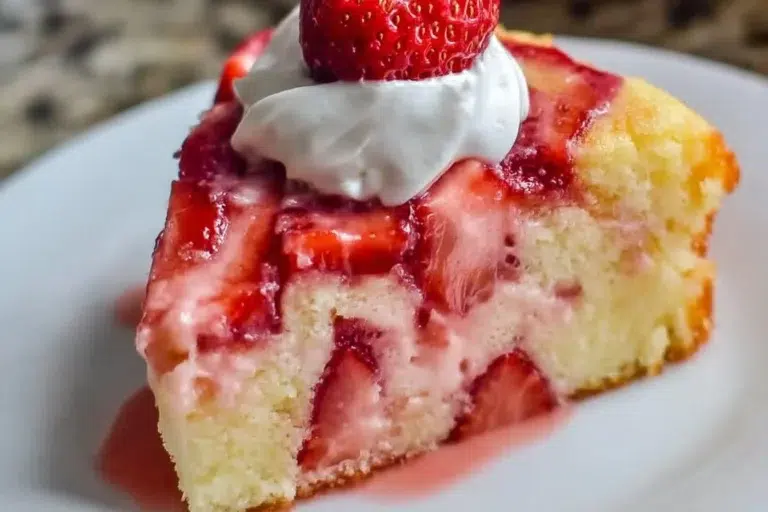 Delicious homemade strawberry earthquake cake with vibrant strawberries and rich frosting.